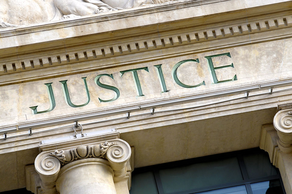 Justice sign on a Law Courts building